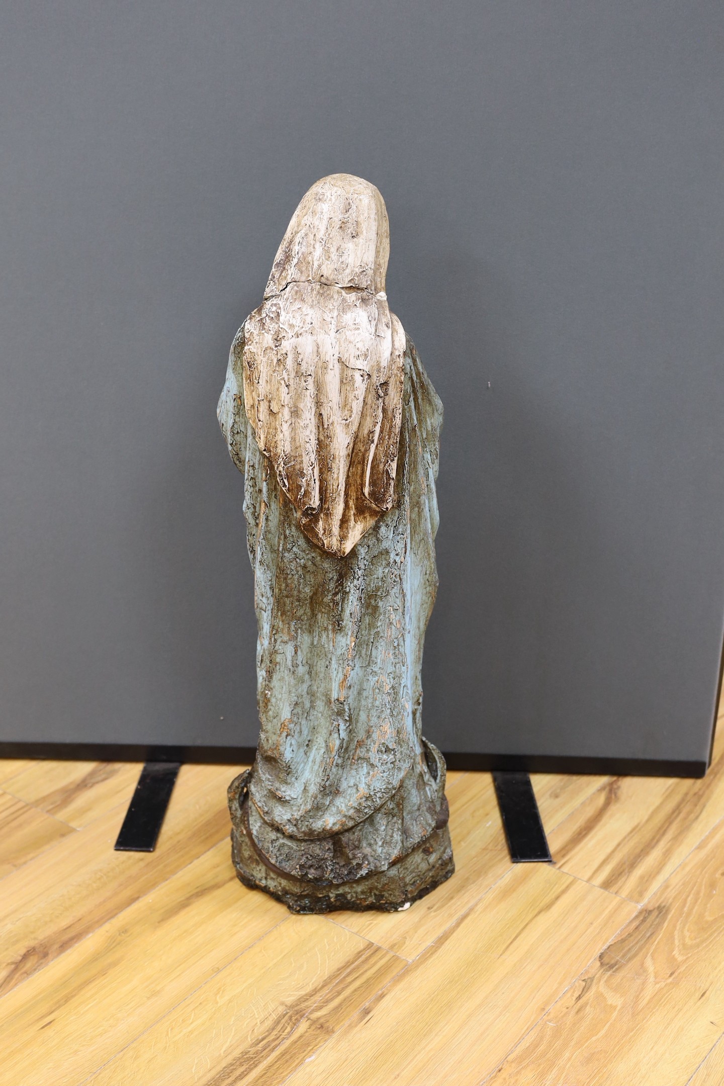 A large painted plaster figure of a Madonna, 82cm